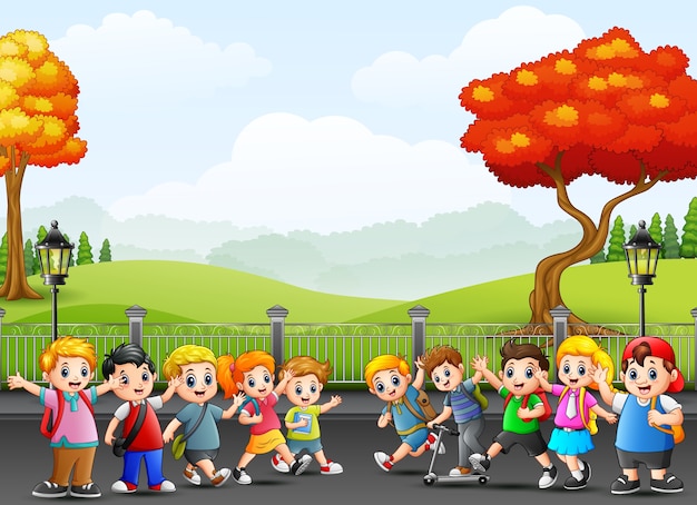 Premium Vector | Cartoon happy school children on the street
