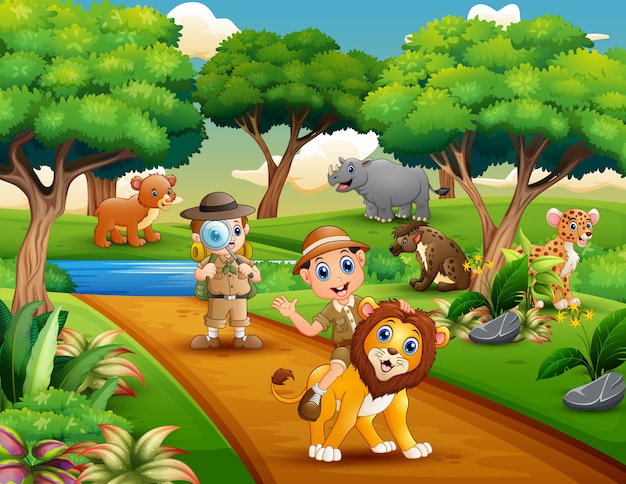 Vettore cartone animato di due boy explorer con animali nella giungla