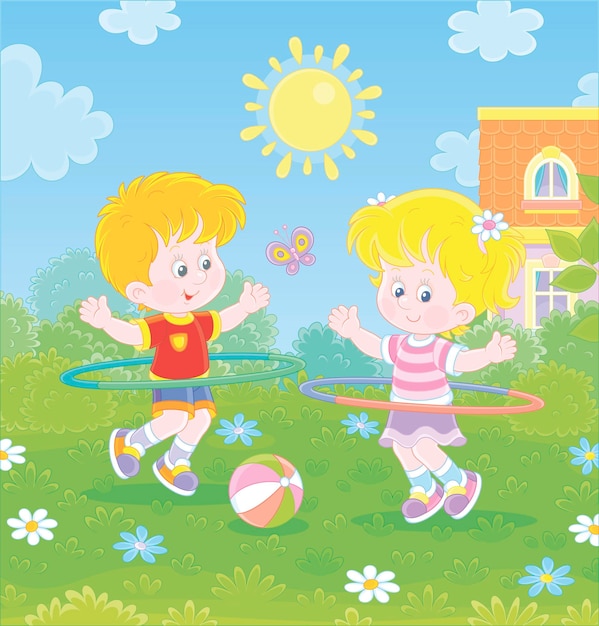 Cheerful cute little kids in colorful sport clothes playing and fun spinning hoops on a green lawn