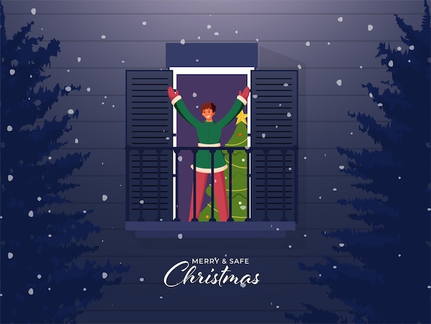 크리스마스 나무와 발코니에 서있는 쾌활 한 어린 소년