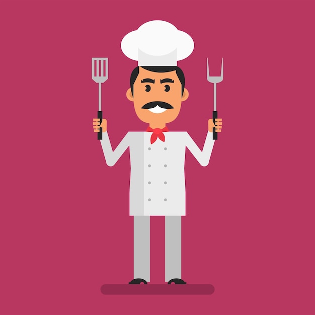 Chef holding fork and spatula and smiling