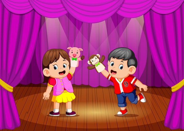 The children playing puppet in the stage