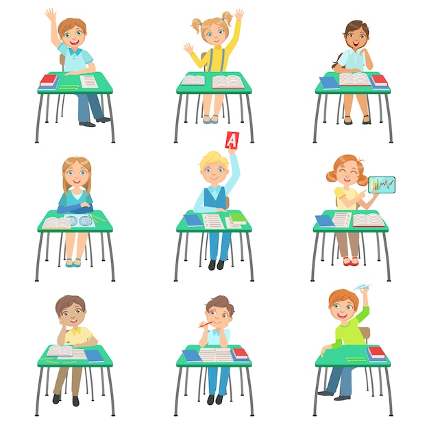 Children sitting at school desks in class