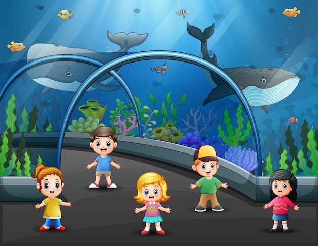 Children visiting aquarium full of fish illustration