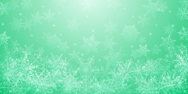 Christmas background of beautiful complex snowflakes in light green colors Winter illustration with falling snow