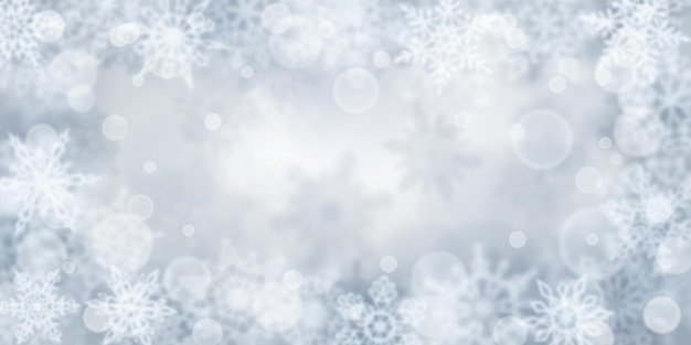 Christmas background of blurry snowflakes in gray colors