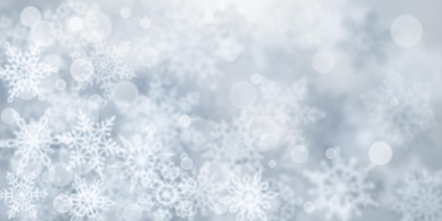 Vector christmas background of blurry snowflakes in gray colors