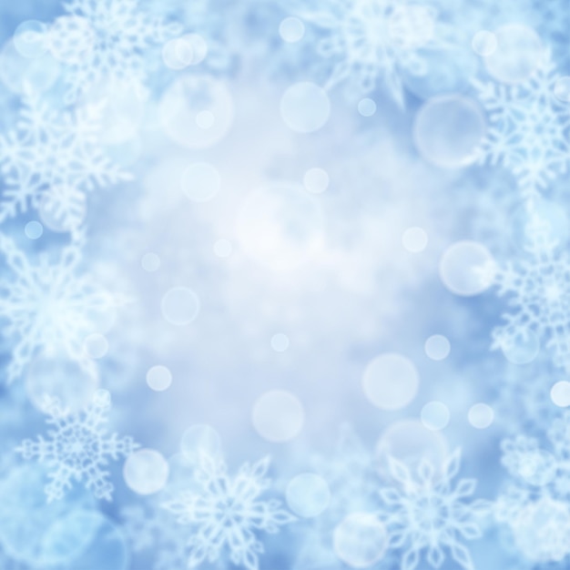 Christmas background of blurry snowflakes in light blue colors