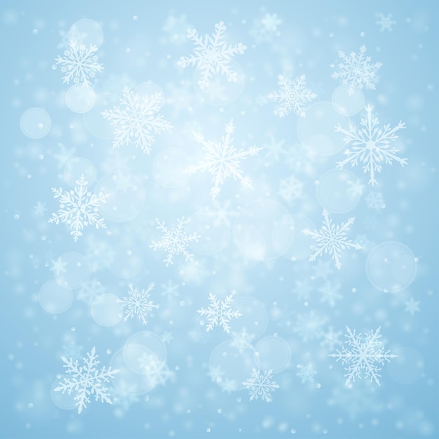 Christmas background of complex blurred and clear falling snowflakes in light blue colors with bokeh effect