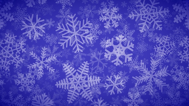 Christmas background of many layers of snowflakes of different shapes sizes and transparency White on blue