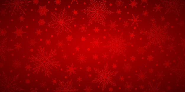 赤い色のさまざまな複雑な大小の雪片のクリスマス背景