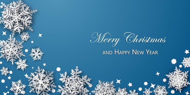 Christmas background of paper snowflakes with soft shadows, white on blue background