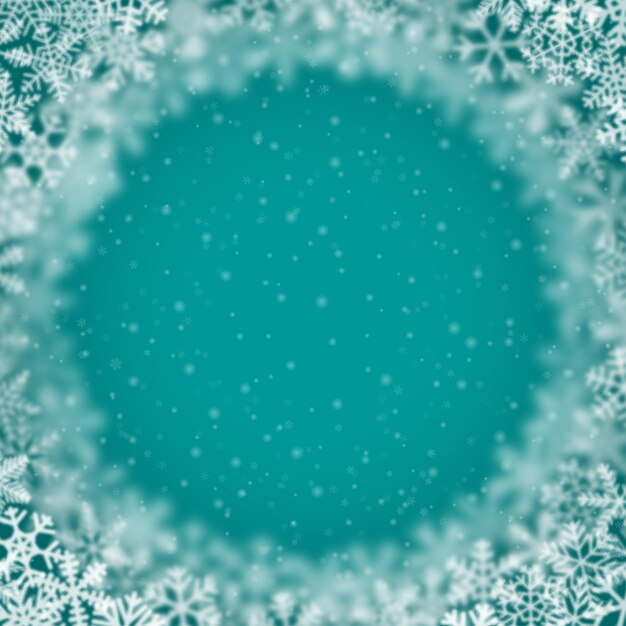 青緑色の背景に円形に配置された、さまざまな形のぼかしと透明度の雪片のクリスマス背景