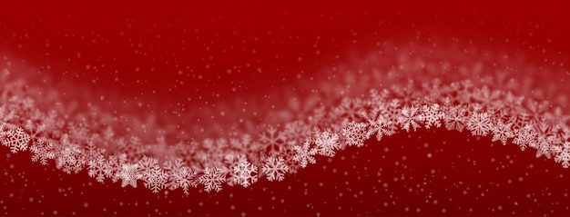 Christmas background of snowflakes of different shape, blur and transparency, wave shaped, on red background