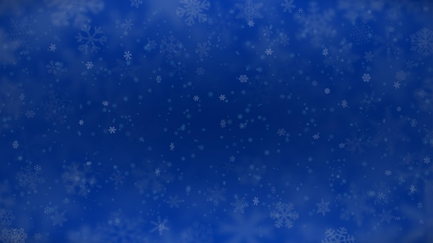 Vector christmas background of snowflakes of different shapes, sizes, blur and transparency in blue colors