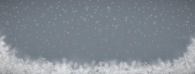 Vector christmas background of snowflakes of different shapes sizes blur and transparency on gray background