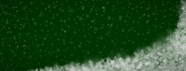 Sfondo di natale di fiocchi di neve di diverse forme dimensioni sfocatura e trasparenza su sfondo verde