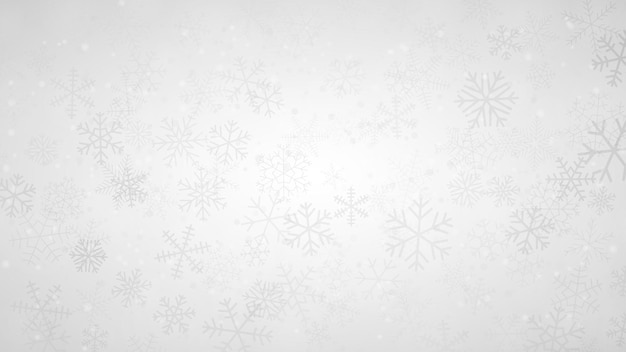 Christmas background of snowflakes of different shapes sizes and transparency in gray and white colors