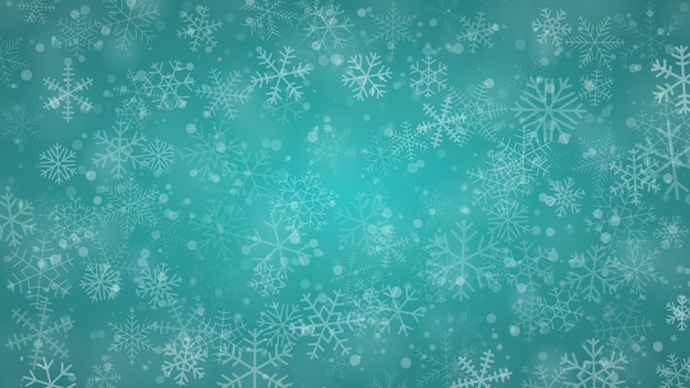 Christmas background of snowflakes of different shapes sizes and transparency in light blue colors