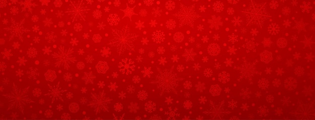 Рождественский фон из различных сложных больших и маленьких снежинок красного цвета
