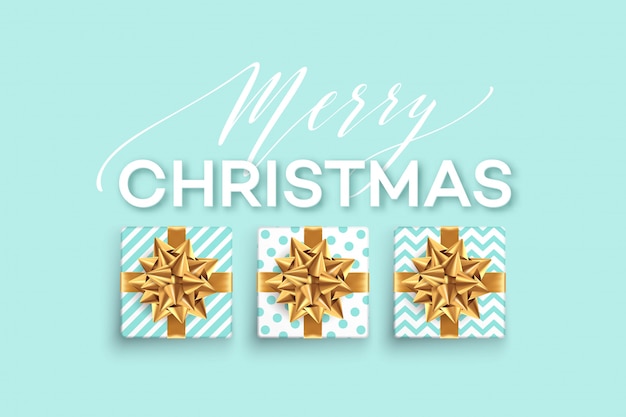 christmas background with gifts boxes with a gold bow. 