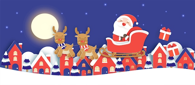 サンタクロースと雪の村の紙のカットとクラフトスタイルのトナカイとクリスマスの背景。