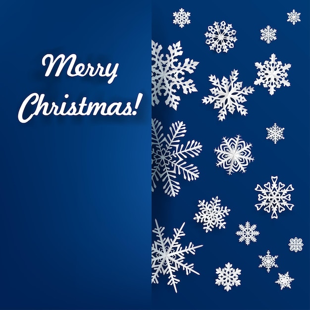 青の背景に紙を切り出したスノーフレークとクリスマスの背景