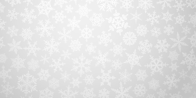 Новогодний фон с различными сложными большими и маленькими снежинками в серых тонах