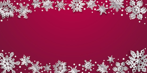 Christmas background with volume paper snowflakes with soft shadows on crimson background