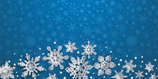 Christmas background with volume paper snowflakes with soft shadows on light blue background