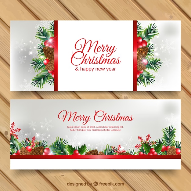 Premium Vector | Christmas banners with pinecones and branches