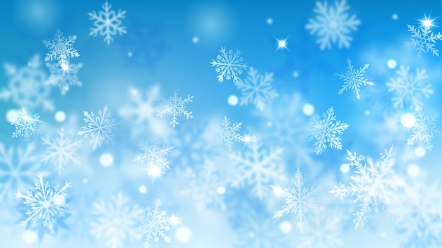 Рождественский размытый фон из сложных расфокусированных больших и маленьких падающих снежинок в голубых тонах с эффектом боке