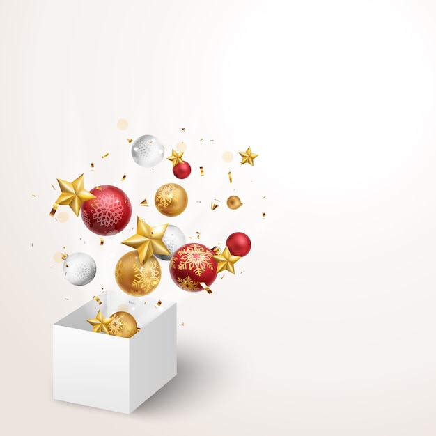 новогодняя коробка над красными и золотыми шарами и звездами