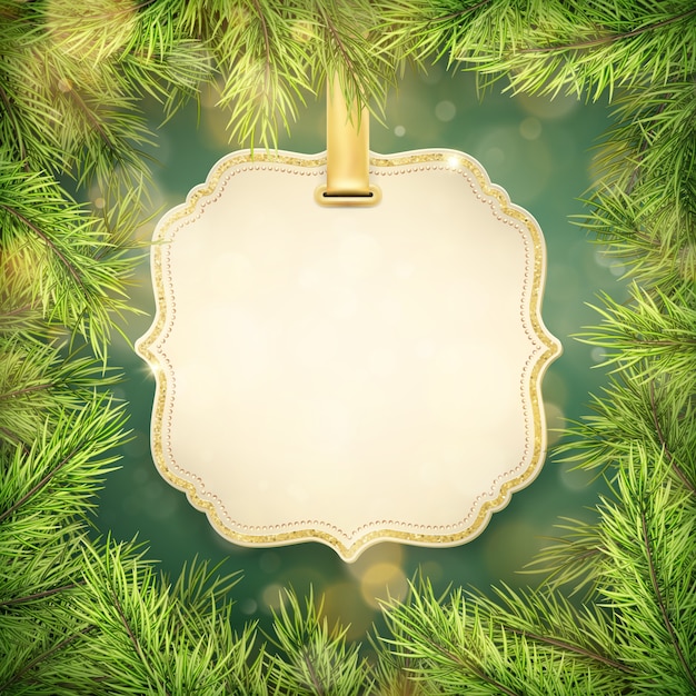 Christmas green pine branches and tag frame with copyspace.