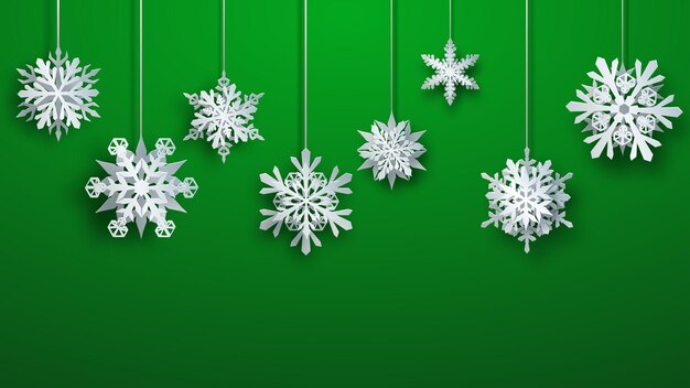 Christmas large complex paper hanging snowflakes on green background