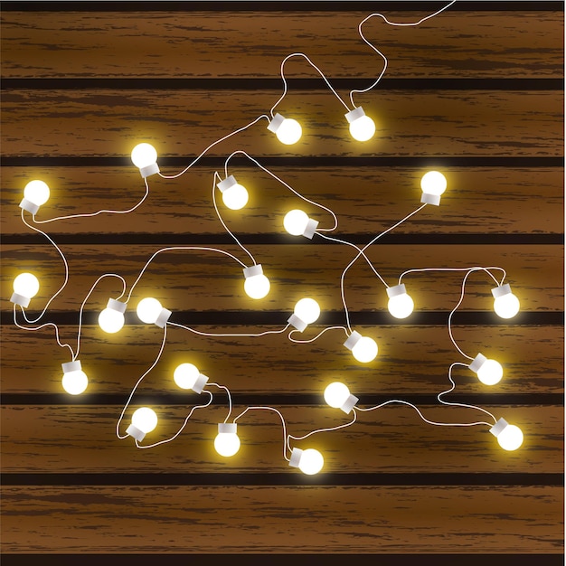 Vector christmas lights isolated on dark wooden background glow garland vector glow xmas light bulbs on wires