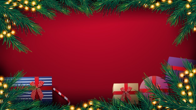 Christmas red background with Christmas tree frame with yellow bulb garland and presents, top view