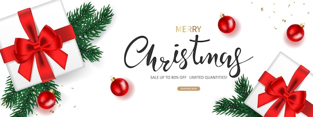 Banner di vendita di natale con confezione regalo e decorazioni festive