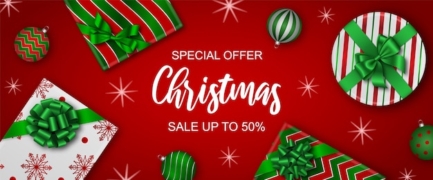 Vector christmas sale banner with gift boxes and christmas balls