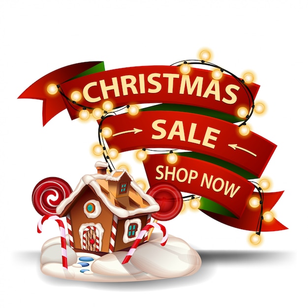 Christmas sale, discount banner in the form of red ribbon, garland wrapped around the ribbon and Christmas gingerbread house. Discount banner isolated 