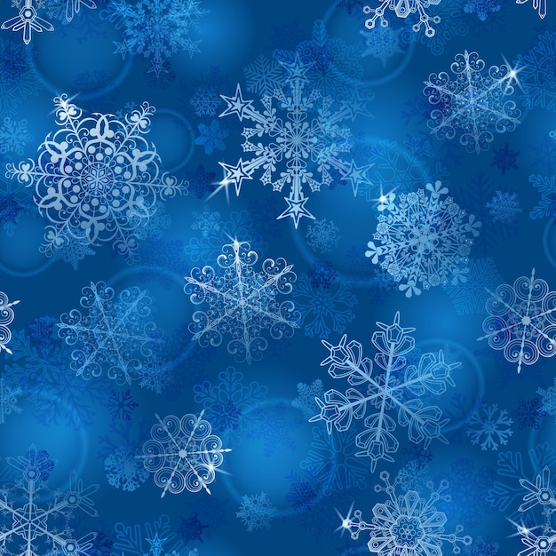 Christmas seamless pattern of snowflakes in blue colors