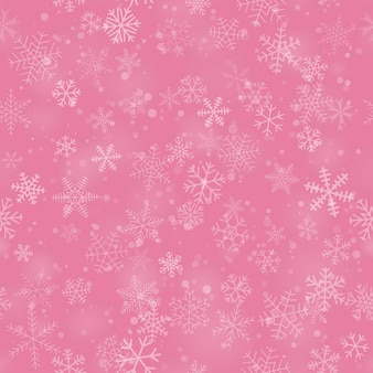 Modello senza cuciture natalizio di fiocchi di neve di diverse forme, dimensioni e trasparenza, su sfondo rosa