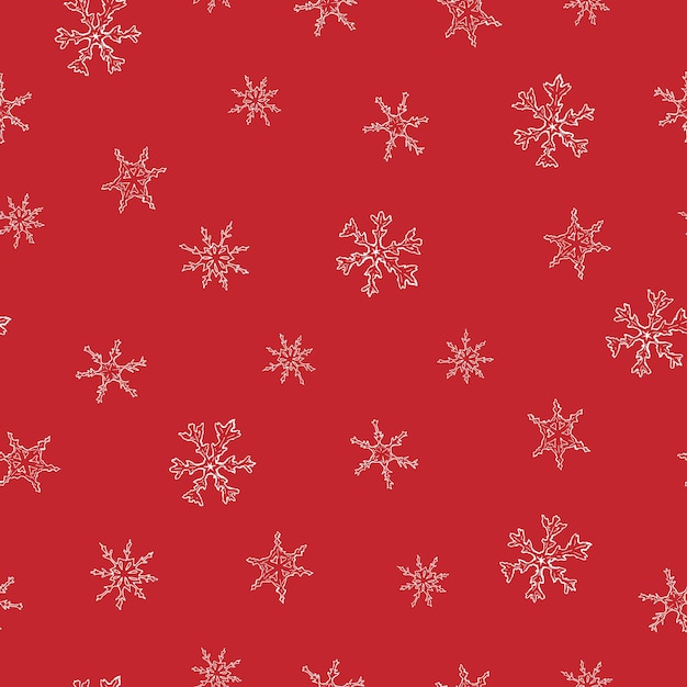 赤い背景に雪の結晶とクリスマスのシームレスなパターン