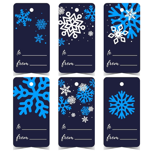 Christmas tags labels or stickers with blue snowflakes and a hole to tie or hang it on a gift box