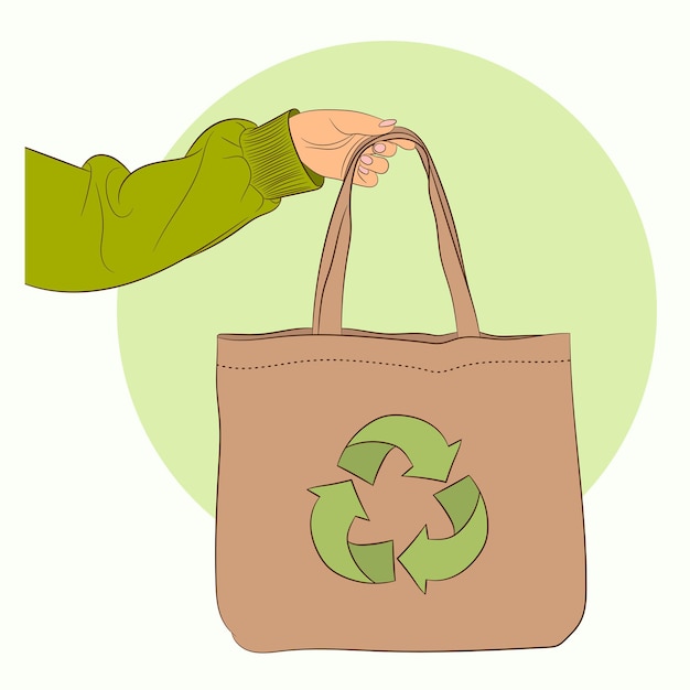 Closeup shot of female hand carrying Eco canvas tote bag with recycling logo