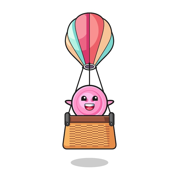 Clothing button mascot riding a hot air balloon