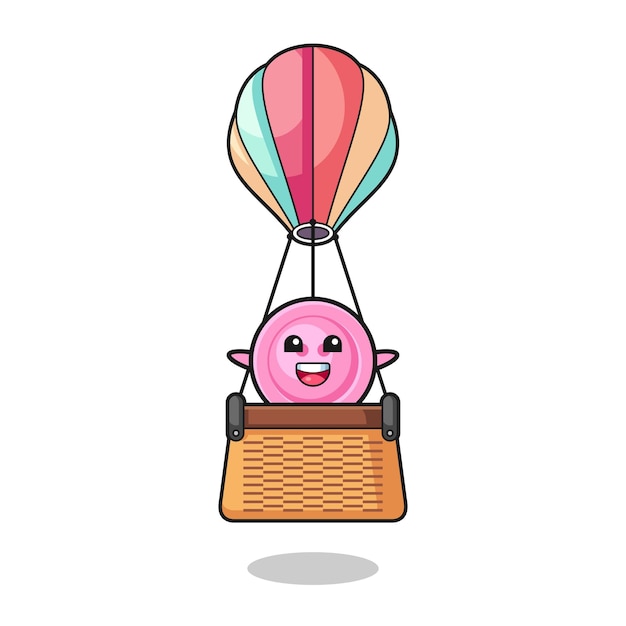Vector clothing button mascot riding a hot air balloon