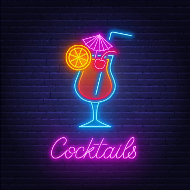 Cocktail tequila sunrise neon sign on brick wall background .