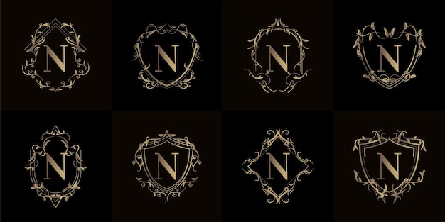 Collezione di logo n iniziale con ornamento di lusso o cornice floreale