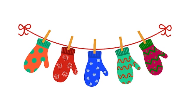 Красочные перчатки, висящие на прищепках на бельевой веревке Концепция счастливых зимних праздников